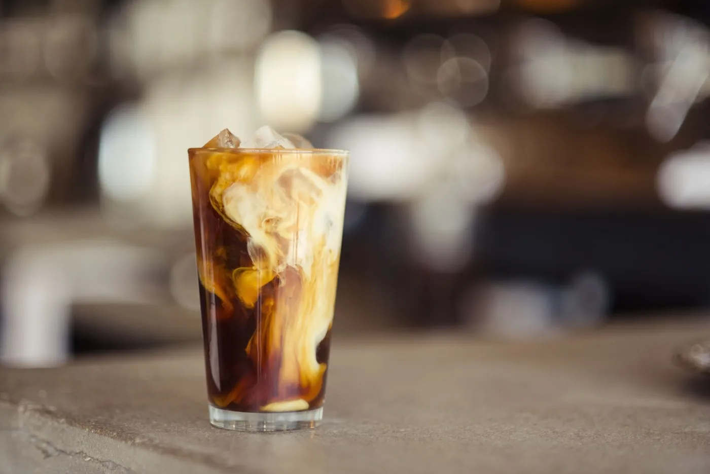 A flight of finished café drinks
